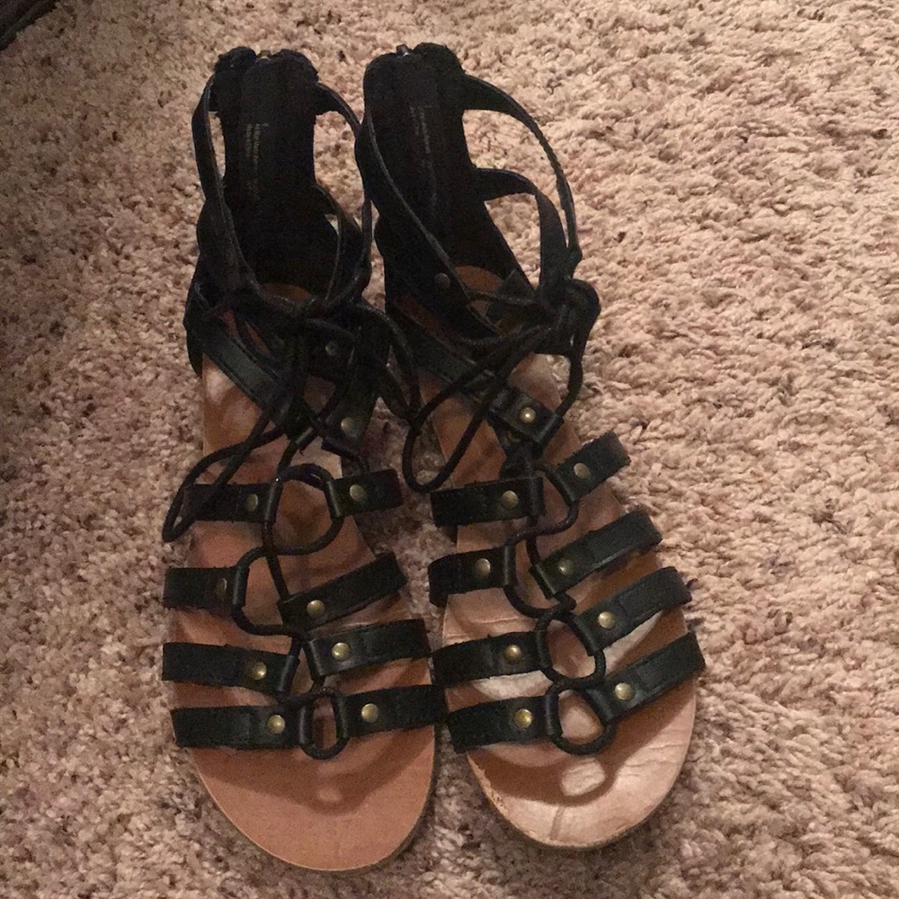 Gladiator style black sandals.